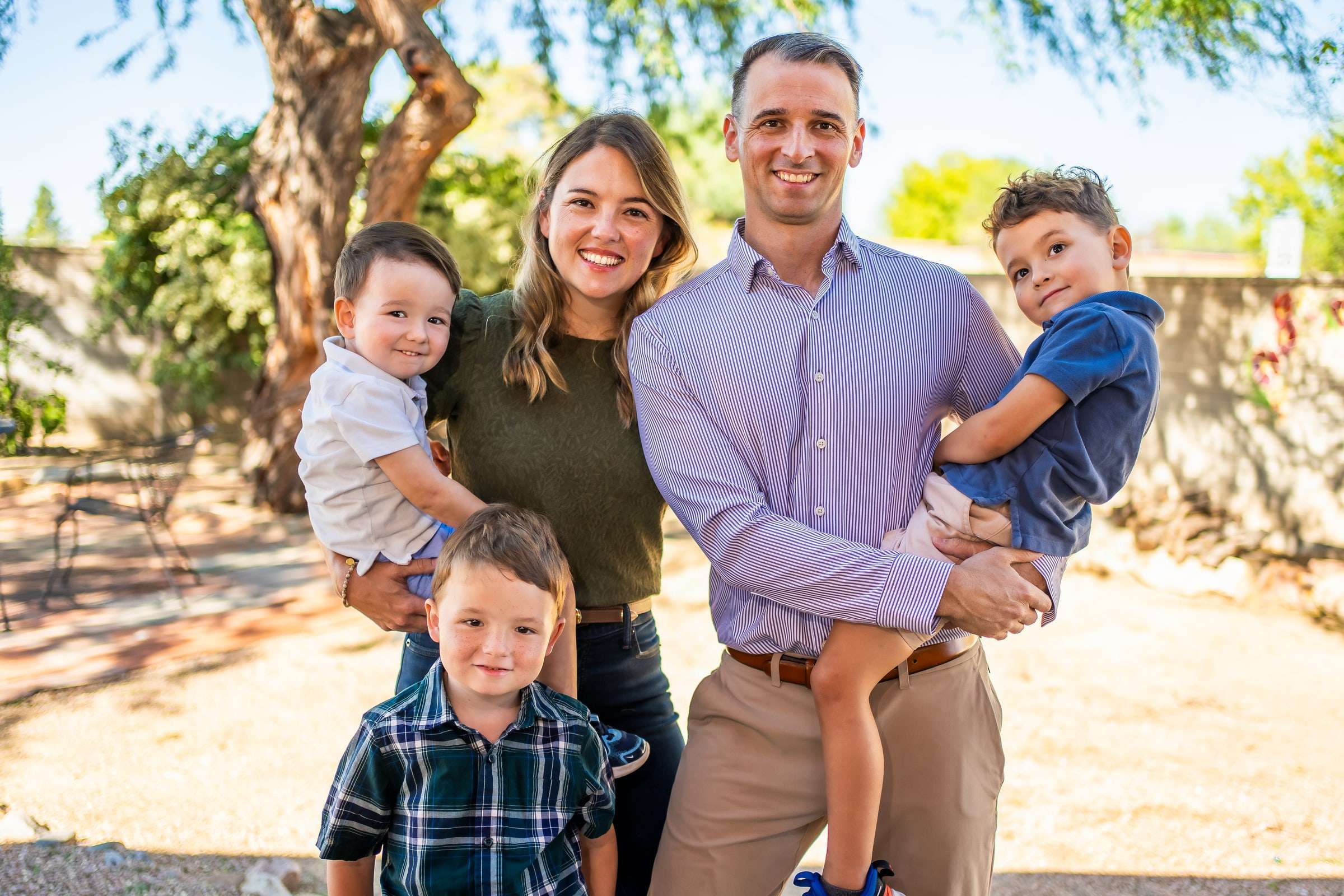 Kyle Witt, MD, outdoors with his family.